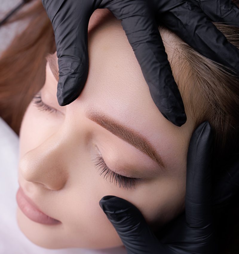 Close-up demonstration of permanent makeup after eyebrow design procedure